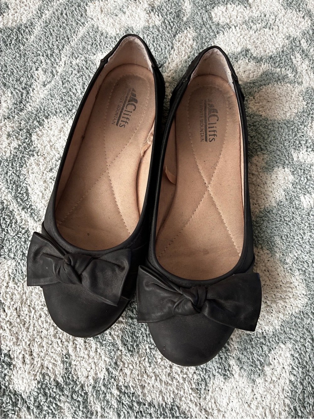 black ballet flats with bow detail